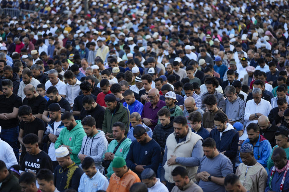 Muslim worshippers pray during Eid al-Fitr morning prayer outside the Mohammad al-Amin Mosque in downtown of Beirut, Lebanon, Friday, April 21, 2023. (AP Photo/Hassan Ammar)