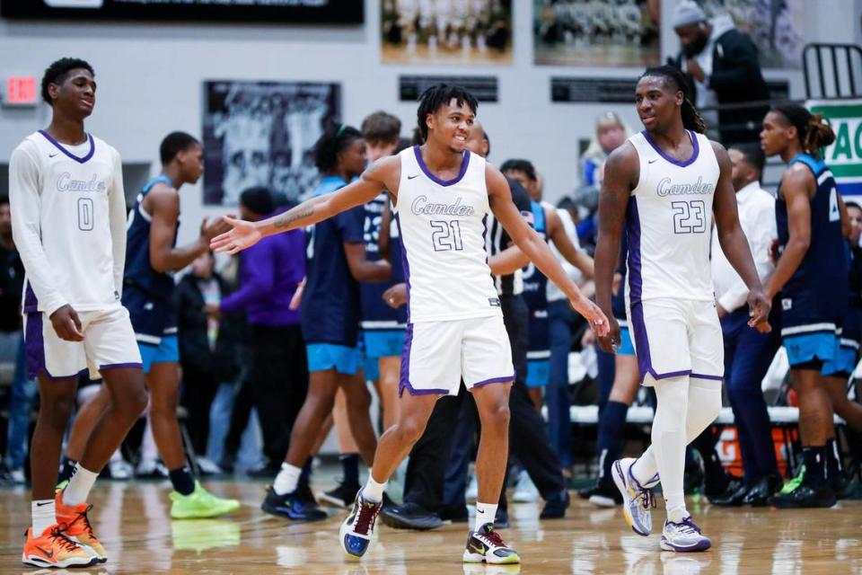 DJ Wagner (21) celebrates with his teammates during Camden’s victory over Combine Academy of North Carolina on Friday night at Kentucky State University.