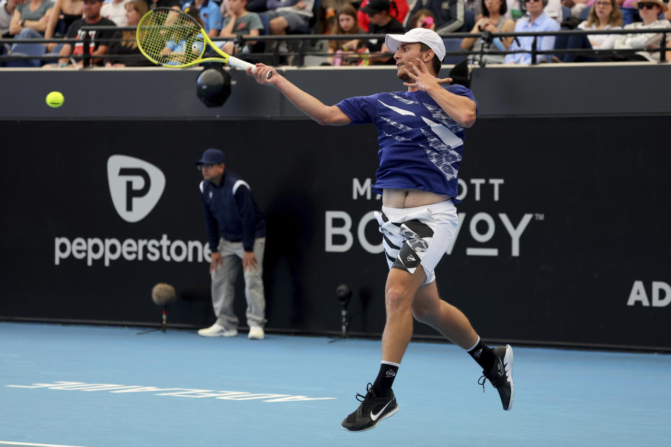Serbia's Miomir Kecmanovic makes a forehand return to Russia's Daniil Medvedev during their Round of 16 match at the Adelaide International Tennis tournament in Adelaide, Australia, Wednesday, Jan. 4, 2023. (AP Photo/Kelly Barnes)