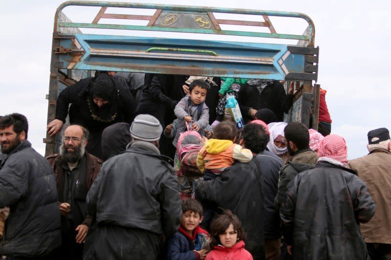 FILE PHOTO: Internally displaced Syrian people who fled Raqqa city get out of a truck at a camp in Ain Issa, Raqqa Governorate, Syria April 1, 2017. REUTERS/Rodi Said