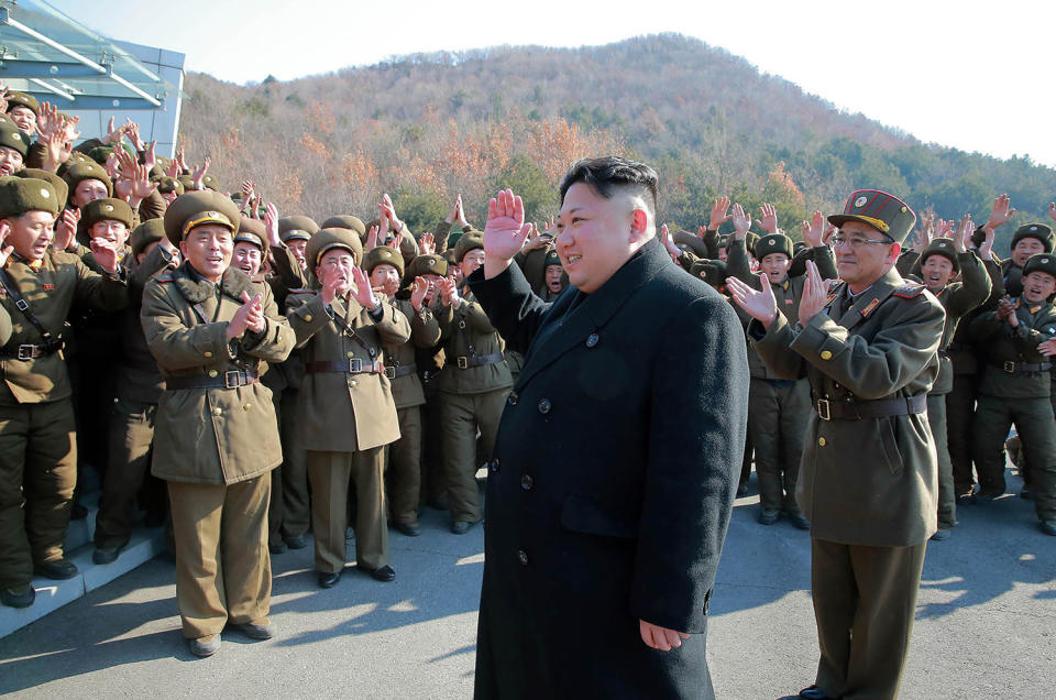 Kim Jong Un waves to officers