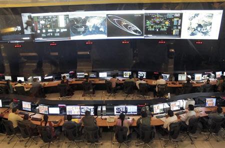 Indian Space Research Organization (ISRO) scientists and engineers monitor the movements of India's Mars orbiter at their Spacecraft Control Center in Bangalore November 27, 2013. REUTERS/Stringer