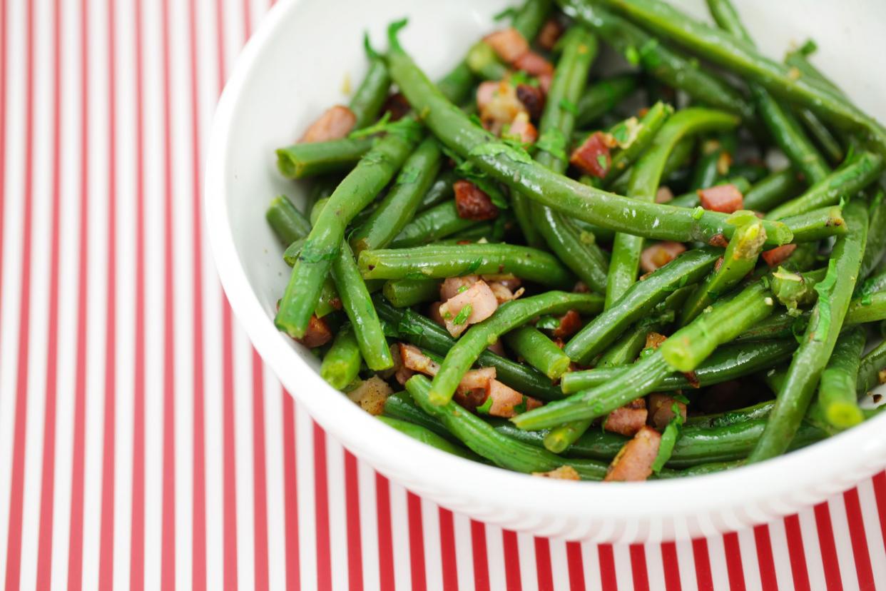 Green string beans or french beans salad with fried ham and vinaigrette
