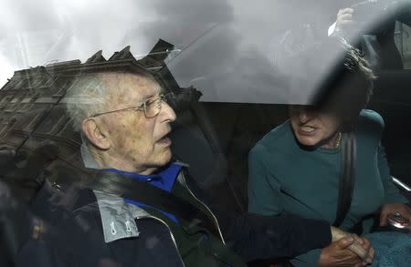 Lord Greville Janner (L) leaves Westminster Magistrates' Court in London, Britain August 14, 2015. REUTERS/Toby Melville