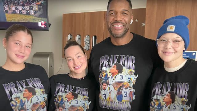<p>Isabella Strahan/YouTube</p> Isabella Strahan and her family wearing t-shirts in honor of Greg Brooks Jr.