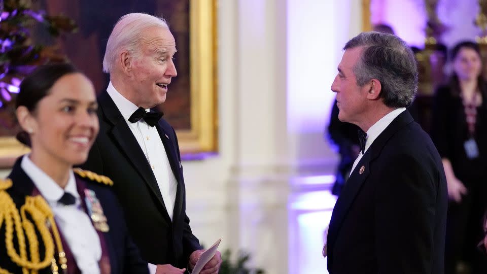 President Joe Biden talks with Delaware Gov. John Carney following a dinner reception for governors and their spouses on February 11 in Washington, DC. - Manuel Balce Ceneta/AP