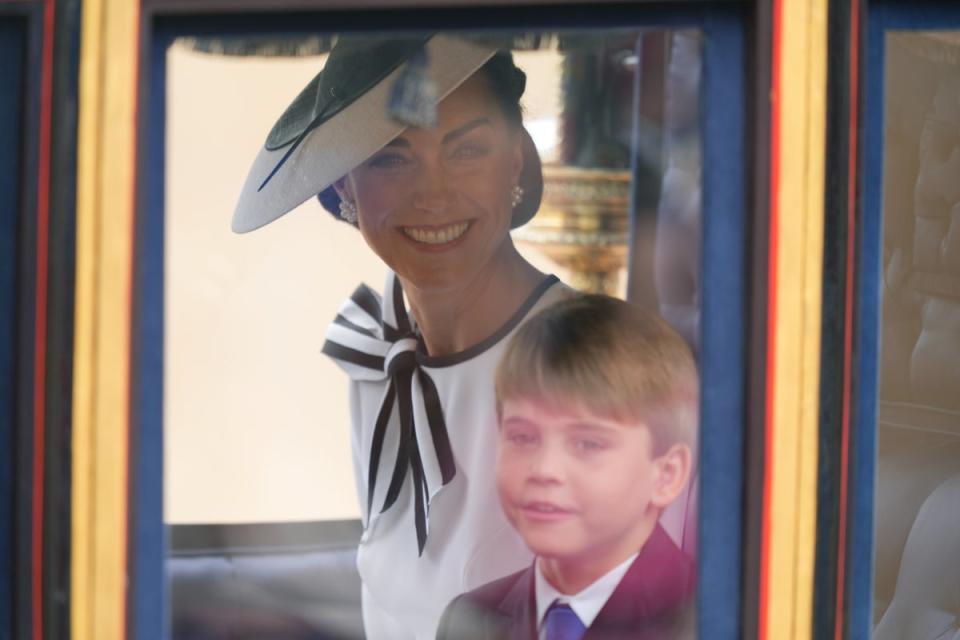 The princess was seen smiling in her carriage alongside her son Louis (Yui Mok/PA)