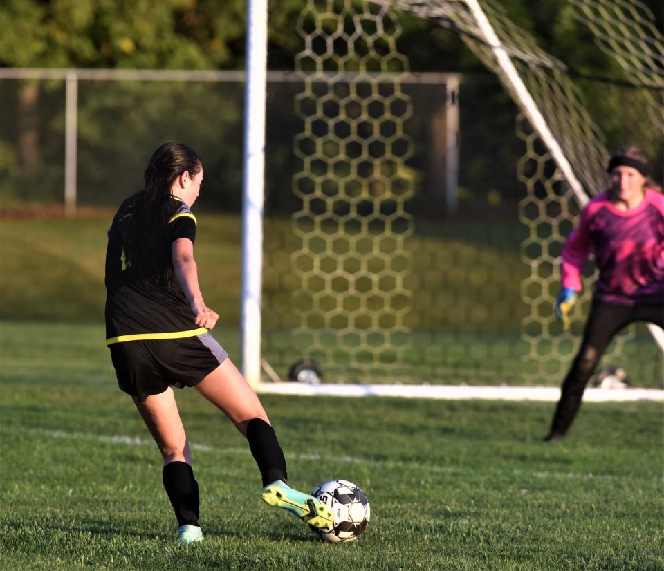 Tri-Valley's Lexie Littick hits a shot towards the goal in this 2021 file photo. The Straker Foundation recently awarded $50,000 to Tri-Valley Boys and Girls Soccer Boosters for field upgrades.