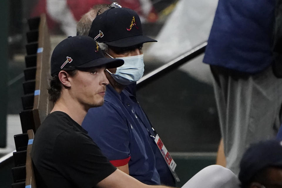 Atlanta Braves' pitcher Max Fried, scheduled to pitch in Game 1 of the National League Championship Series against the Los Angeles Dodgers, watches as the Dodgers work out in Arlington, Texas, Sunday, Oct 11, 2020. The series begins Monday, Oct. 12. (AP Photo/Sue Ogrocki)