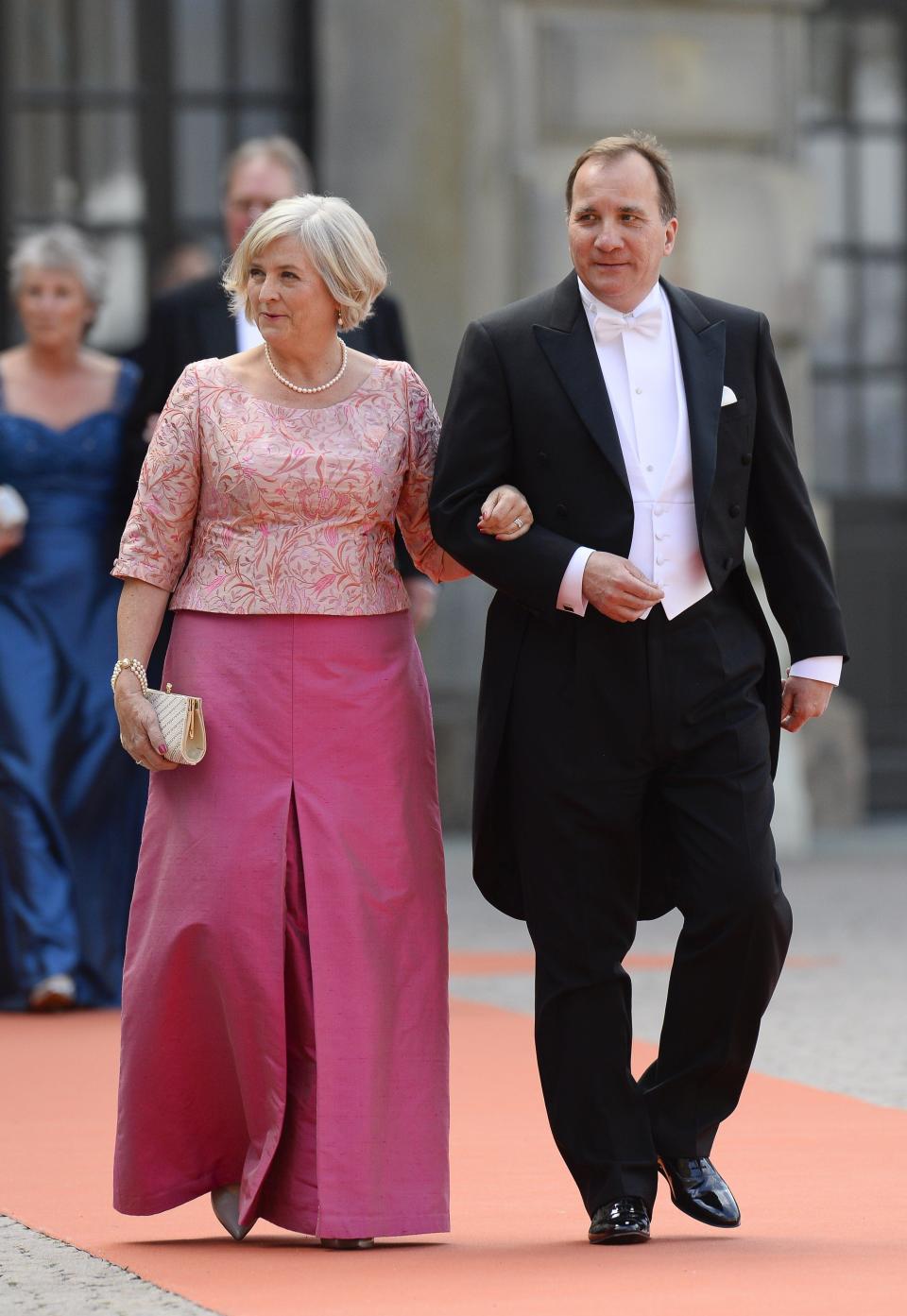 The Swedish prime minister and his wife at Prince Carl Philip and Sofia of Sweden's wedding.