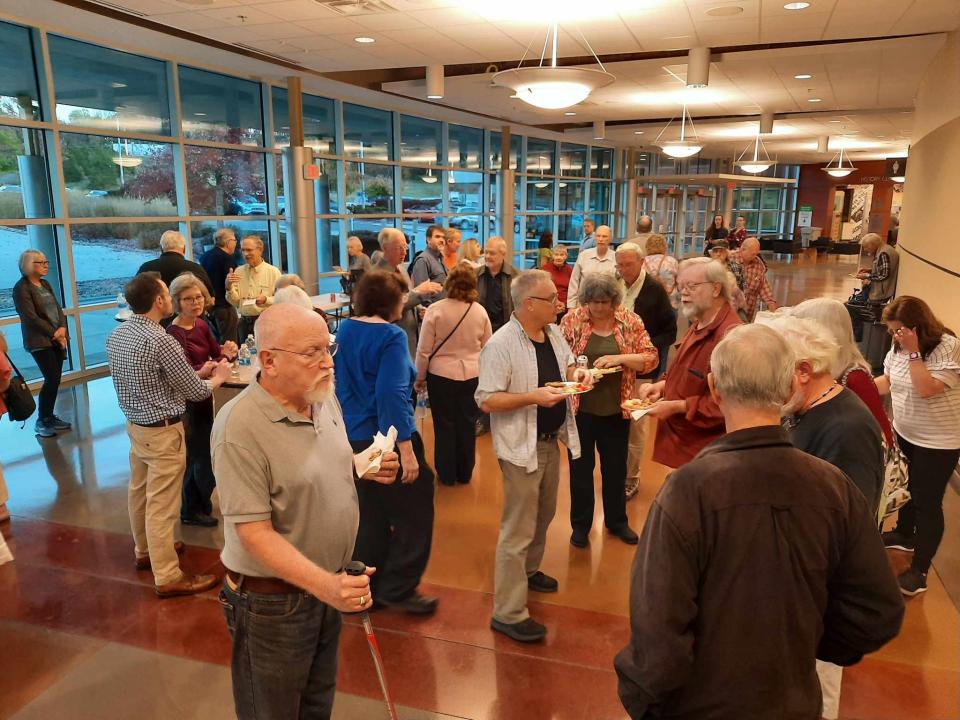 People mingle at the reception before Lynne Parker gave her lecture.