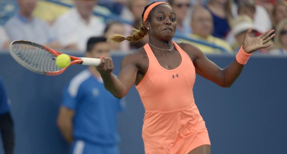 Sloane Stephens, from the United States, returns the ball during a match against Maria Sharapova, from Russia, at the Western & Southern Open tennis tournament, Tuesday, August 13, 2013, in Mason, Ohio. (AP Photo/Michael E. Keating)