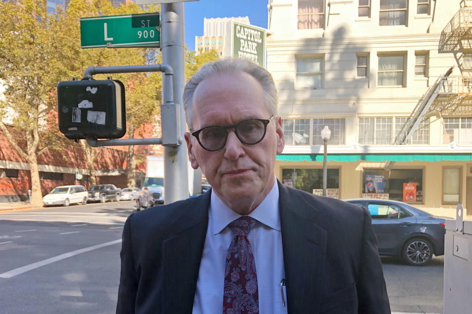 Pacific Gas & Electric CEO Bill Johnson speaks with reporters after meeting with California Gov. Gavin Newsom in Sacramento, Calif., Tuesday, Nov. 5, 2019. Newsom is trying to speed up PG&E's bankruptcy case so it can be resolved by next year's wildfire season. (AP Photo/Adam Beam)