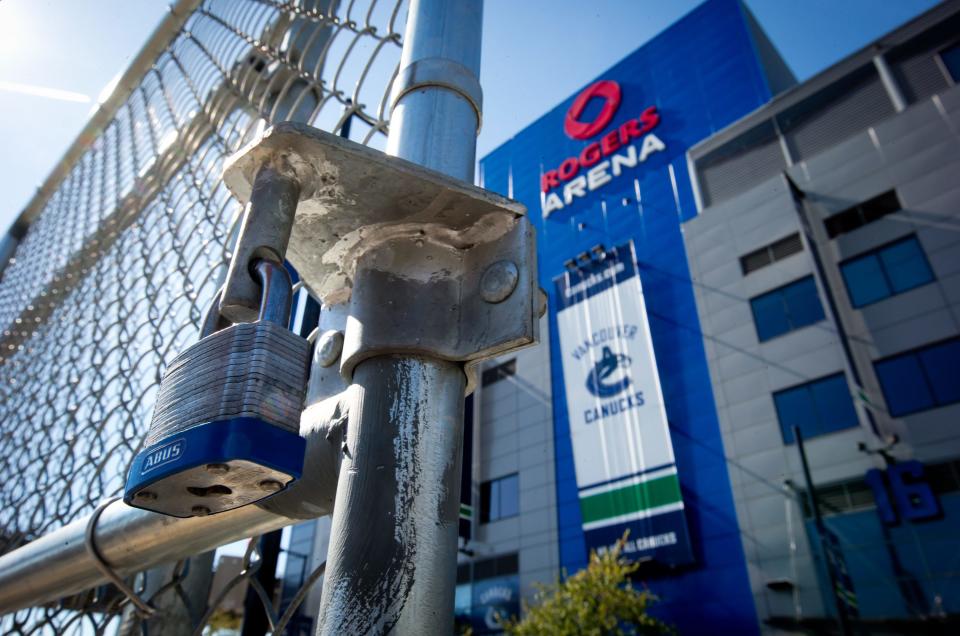 A padlock is seen on a parking lot gate outside Rogers Arena, the home of the Vancouver Canucks NHL hockey team, in Vancouver, British Columbia, on Sunday Sept. 16, 2012. The NHL locked out its players at midnight Saturday, the fourth shutdown for the NHL since 1992, including a year-long dispute that forced the cancellation of the entire 2004-05 season. (AP Photo/The Canadian Press, Darryl Dyck)