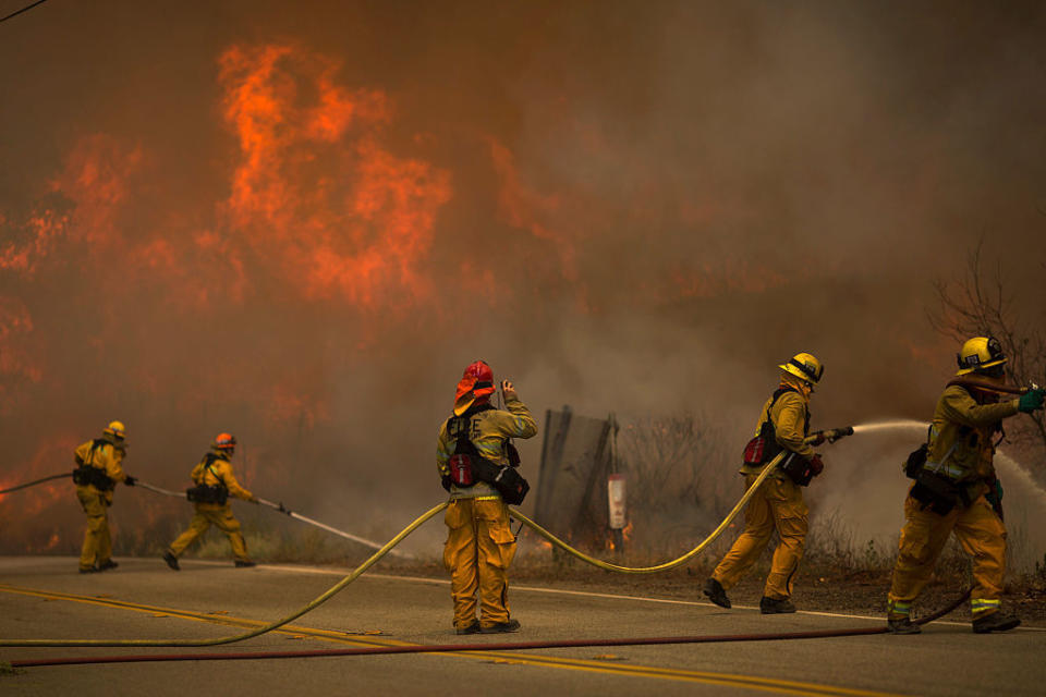 <p>Firefighters battle flames in Placerita Canyon at the Sand Fire on July 24, 2016 in Santa Clarita, California.</p>