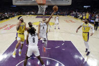 Brooklyn Nets' Timothe Luwawu-Cabarrot (9) drives to the basket against the Los Angeles Lakers during the first half of an NBA basketball game Tuesday, March 10, 2020, in Los Angeles. (AP Photo/Marcio Jose Sanchez)