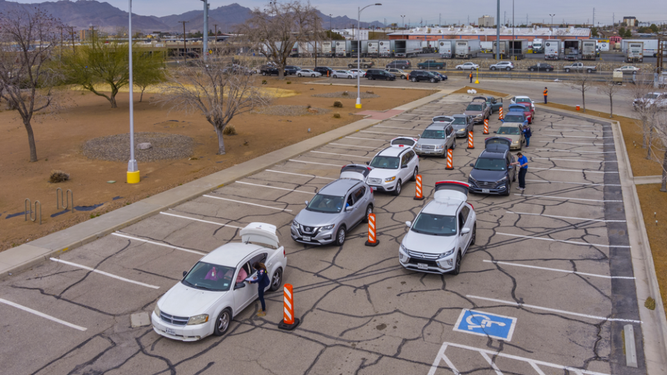 Vehicles line up for a distribution event at MPC's El Paso refinery where monthly demand for food assistance has grown from an average of 50 families to about 400.