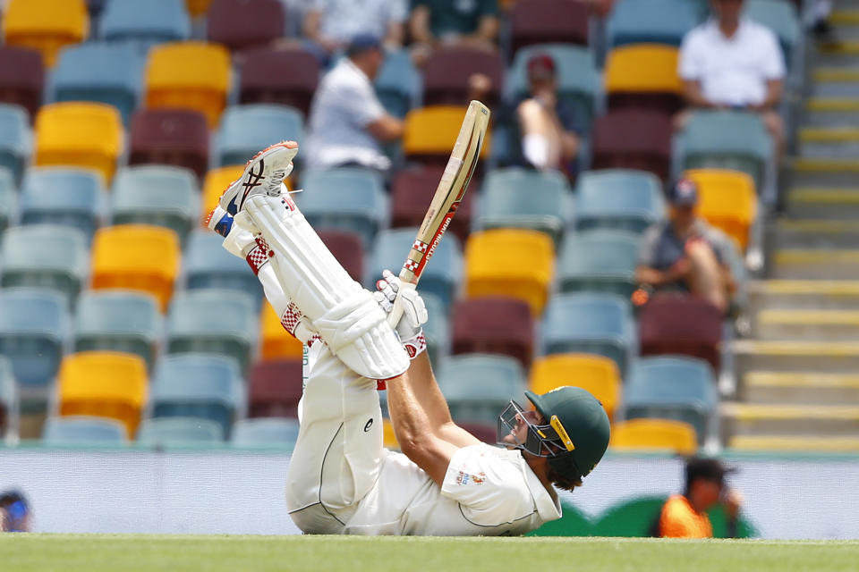 Australia's Joe Burns falls over during their cricket test match against Pakistan in Brisbane, Australia, Friday, Nov. 22, 2019. (AP Photo/Tertius Pickard)