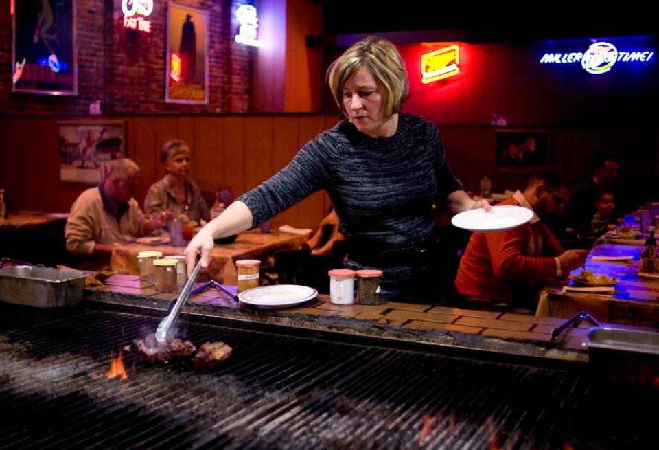 Stephanie Fisher cooks a steak on Thursday, Nov. 25, 2010, at Alexander's Steakhouse. In addition to a special Thanksgiving menu, the restaurant also offered its full menu to customers, prompting some to opt out of a traditional turkey meal for steak.