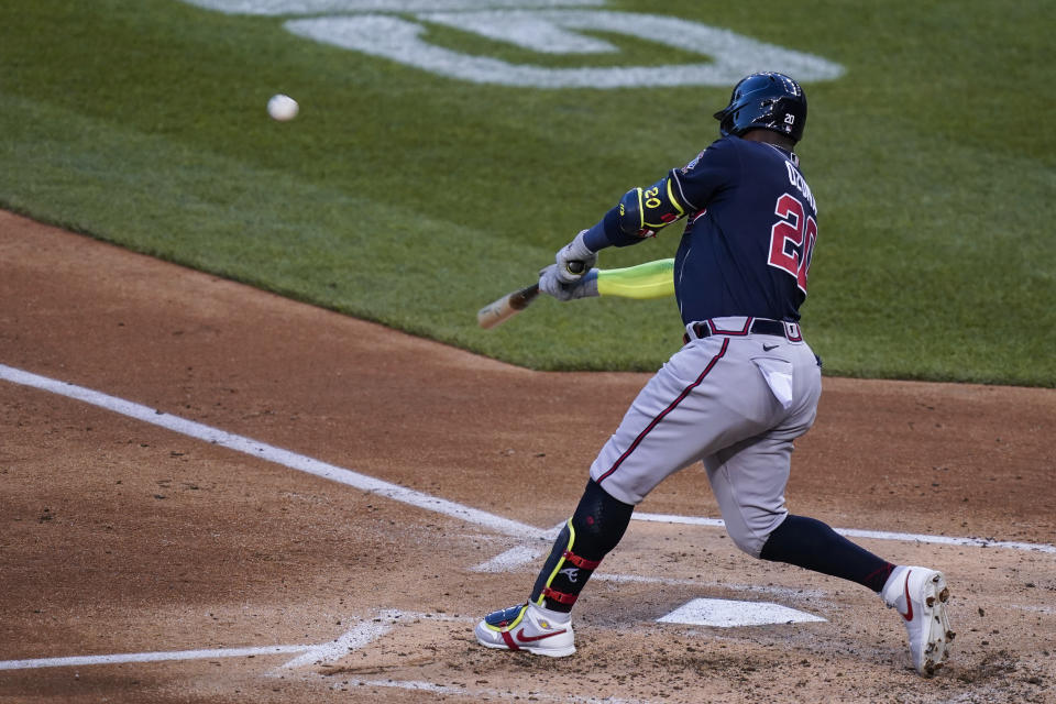 Atlanta Braves' Marcell Ozuna hits a grand slam during the third inning of the team's baseball game against the Washington Nationals at Nationals Park, Wednesday, May 5, 2021, in Washington. (AP Photo/Alex Brandon)