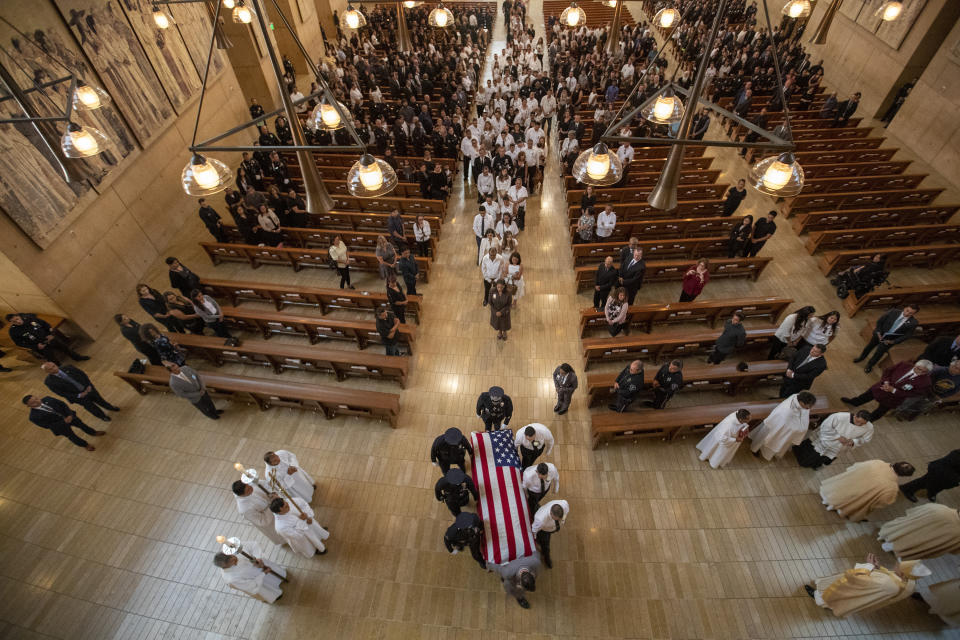 Pallbearers carry casket out following a funeral mass for slain Los Angeles Police officer Juan Diaz at the Cathedral of Our Lady of the Angels in Los Angeles, Calif., on Monday, Aug. 12, 2019. (Brian van der Brug/Los Angeles Times via AP, Pool)