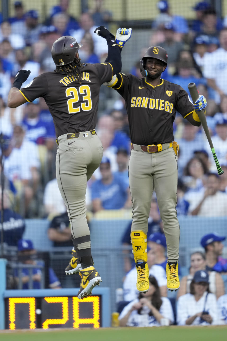 San Diego Padres' Fernando Tatis Jr., left, celebrates his solo home run with Jurickson Profar during the first inning in Game 2 of a baseball NL Division Series against the Los Angeles Dodgers, Sunday, Oct. 6, 2024, in Los Angeles.