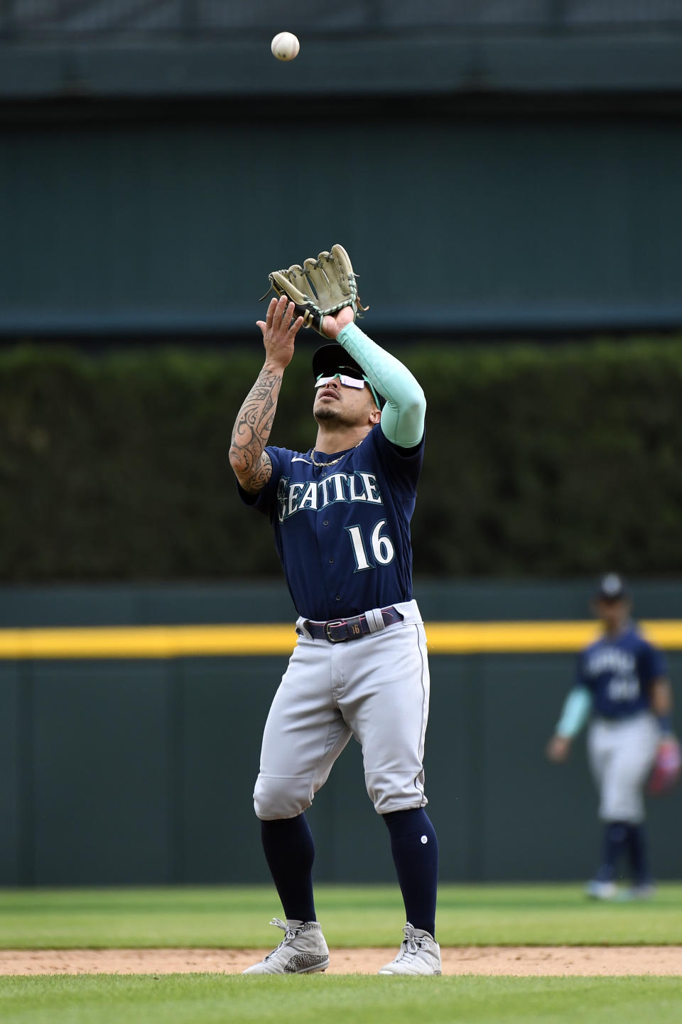 Seattle Mariners second baseman Kolten Wong catches an infield fly ball hit by Detroit Tigers' Nick Maton in the seventh inning of a baseball game, Saturday, May 13, 2023, in Detroit. (AP Photo/Jose Juarez)