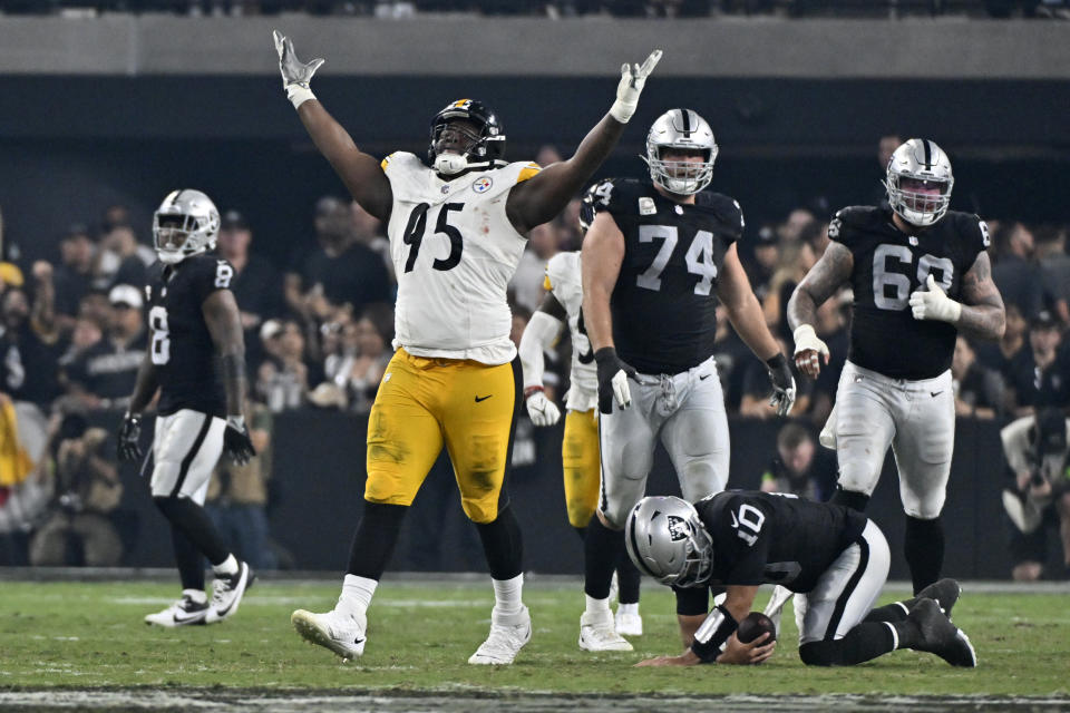 Pittsburgh Steelers defensive tackle Keeanu Benton (95) celebrates after sacking Las Vegas Raiders quarterback Jimmy Garoppolo (10) during the second half of an NFL football game Sunday, Sept. 24, 2023, in Las Vegas. (AP Photo/David Becker)