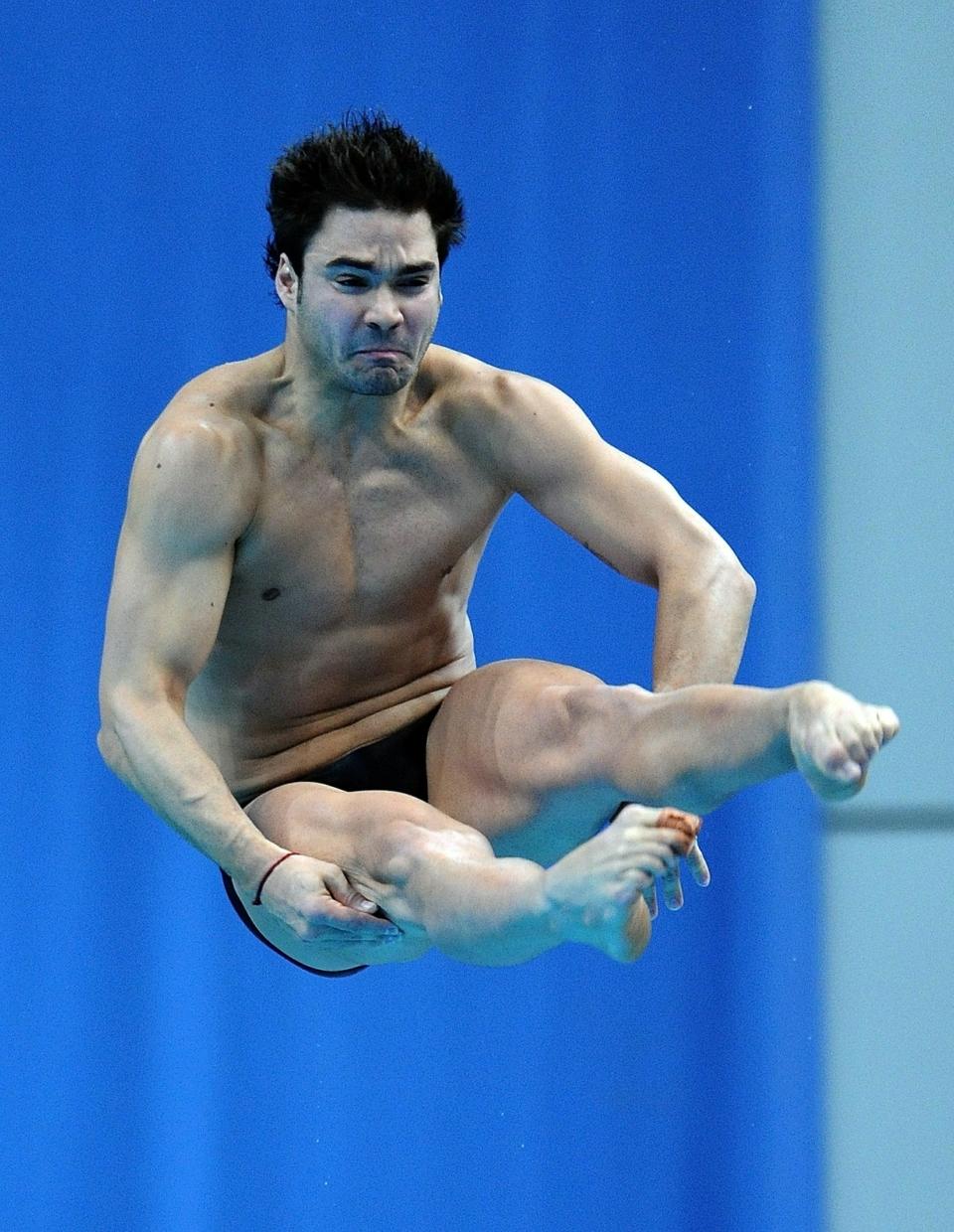 Alexandre Despatie of Canada competes in the men's 3m springboard diving finals at the Dr. S. P. Mukherjee Aquatics Complex during the Commonwealth Games in New Delhi on October 11, 2010. Alexandre Despatie of Canada won the gold. AFP PHOTO/Prakash SINGH (Photo credit should read PRAKASH SINGH/AFP/Getty Images)