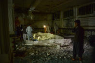 <p>Afghan security personel inspect the site of a suicide bomb attack at a Shiite mosque in Herat on August 1, 2017. (Photo: Hoshang Hashimi/AFP/Getty Images) </p>