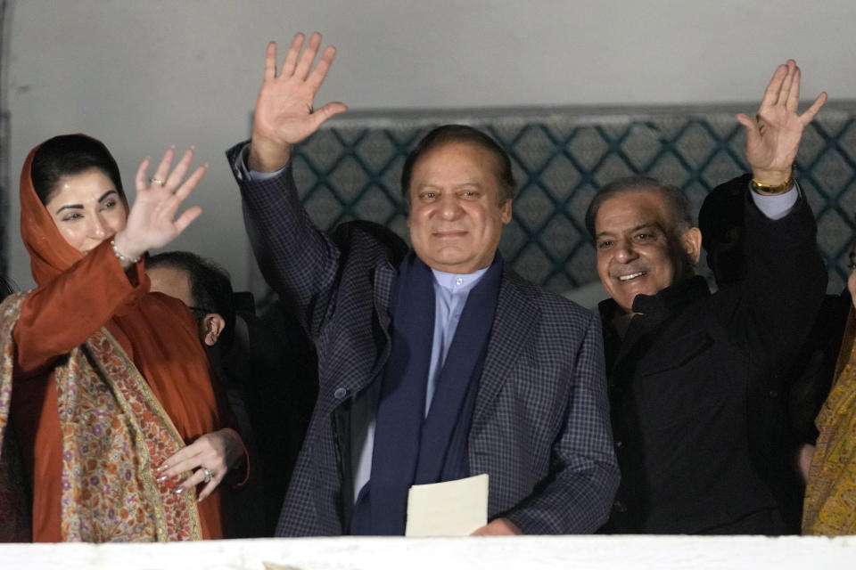 Pakistan's Former Prime Minister Nawaz Sharif, center his brother Shehbaz Sharif, right, and daughter Maryam Nawaz wave to their supporters following initial results of the country's parliamentary election, in Lahore, Pakistan, Friday, Feb. 9, 2024. Sharif is changing tack and said on Friday that he will seek to form a coalition government after his party trailed the independent candidates of his rival Imran Khan in preliminary results following the country’s parliamentary election. (AP Photo/K.M. Chaudary)