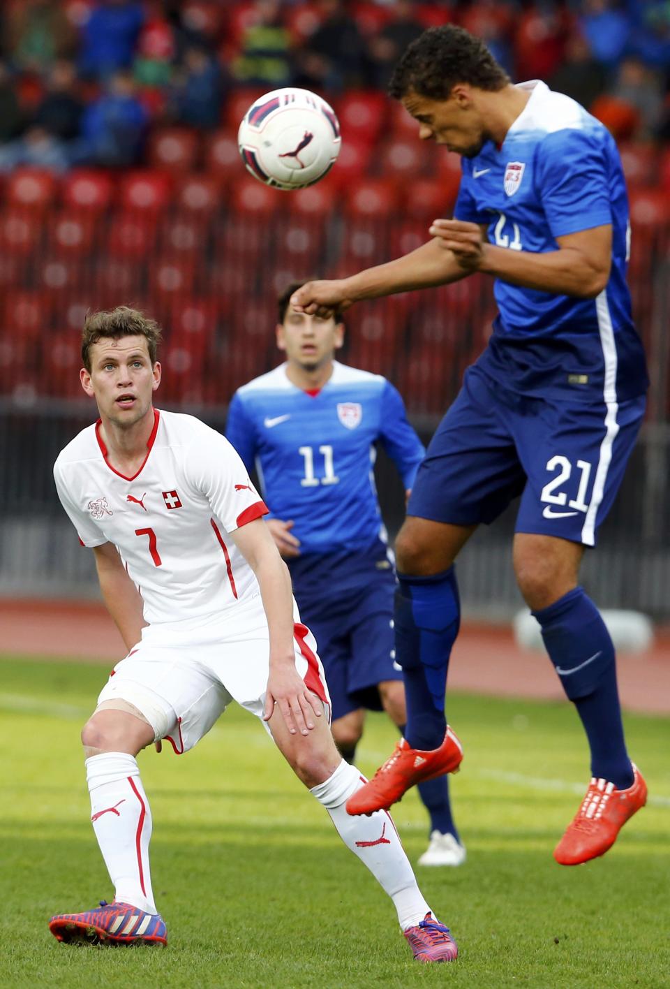 Frei of Switzerland challenges Chandler of the U.S during their international friendly soccer match at the Letzigrund Stadium in Zurich