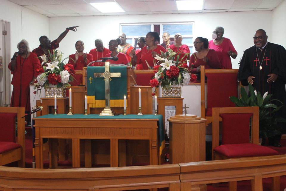 The Mount Olive AME Church choir, flanked to the right by the Rev. John D. Williams Sr., pastor of the church, sing during the final day of the descendants of the Rosewood Massacre of 100 years ago family reunion held this weekend in Gainesville. The reunion ended with a worship service Sunday at church at 721 SE Eighth St. and a luncheon afterwards at the Cotton Club Museum and Cultural Center adjacent to the church.
(Credit: Photo by Voleer Thomas/For The Guardian)