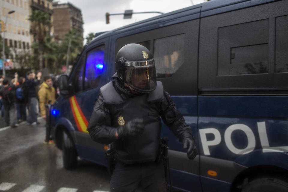 <p>A Spanish police officer is pictured outside the Ramon Llull polling station in Barcelona Oct. 1, 2017 during a referendum on independence for Catalonia banned by Madrid. (Photo: Fabio Bucciarelli/AFP/Getty Images) </p>