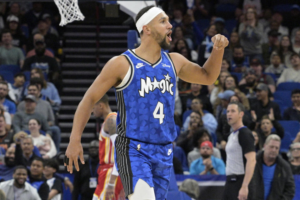 Orlando Magic guard Jalen Suggs (4) reacts after a 3-point basket during the first half of an NBA basketball game against the Atlanta Hawks, Sunday, Jan. 7, 2024, in Orlando, Fla. (AP Photo/Phelan M. Ebenhack)