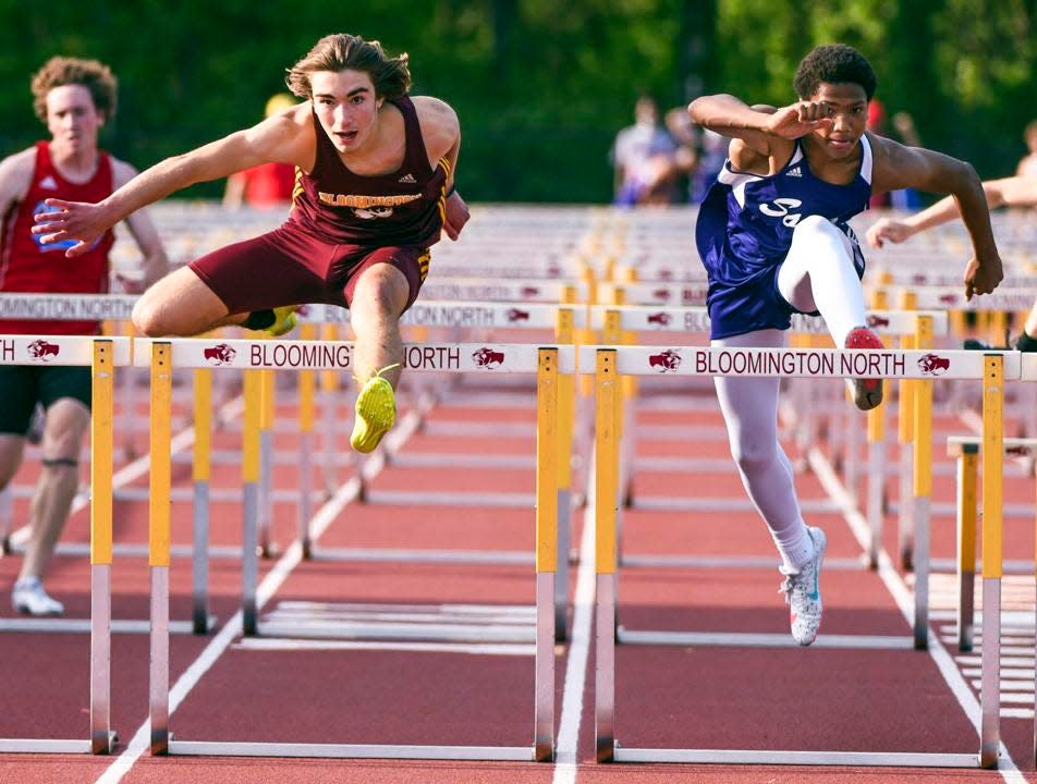 Bloomington North's Broc Murphy, left, and Bloomington South's D'Andre Black go head-to-head in the 110 meter hurdles final at the North Sectional on May 18, 2023.