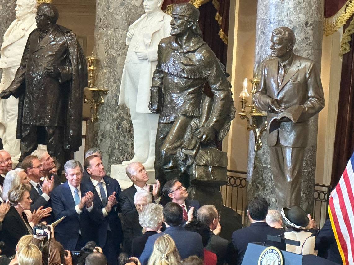 Speaker Mike Johnson and North Carolina’s lawmakers watch as a statue of Billy Graham is unveiled in a ceremony at the Capitol in Washington, DC on May 16, 2024.