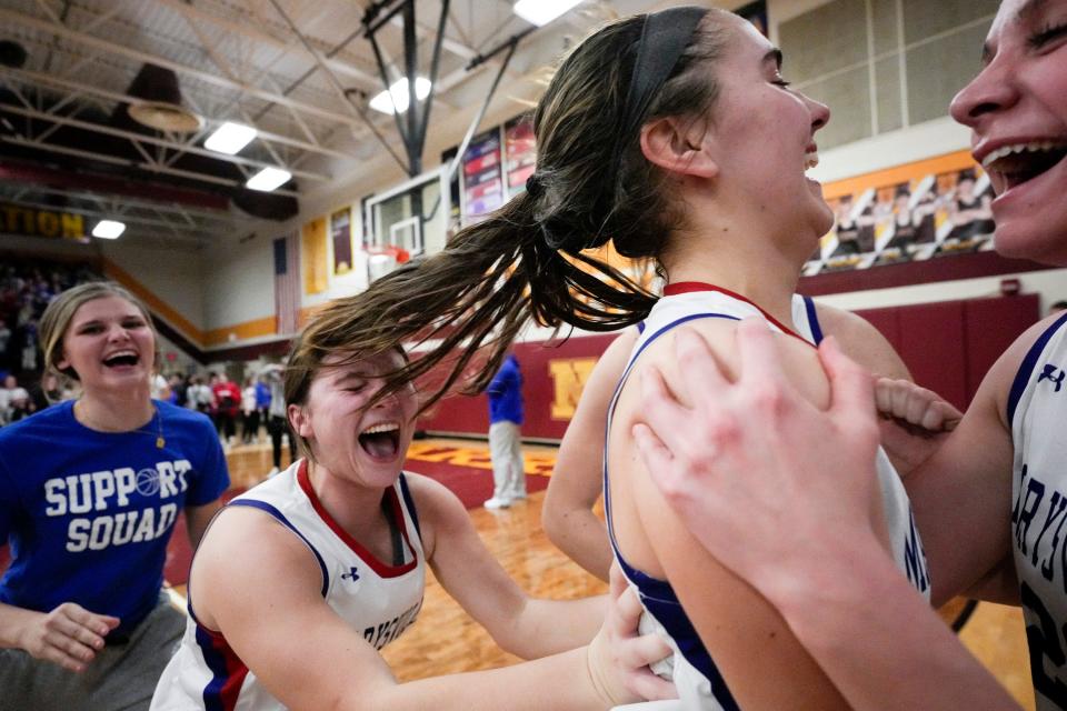 Marysville's Leah Brown, center, celebrates with Cam Lee and Addy Tweed after the Monarchs defeated Westerville South.