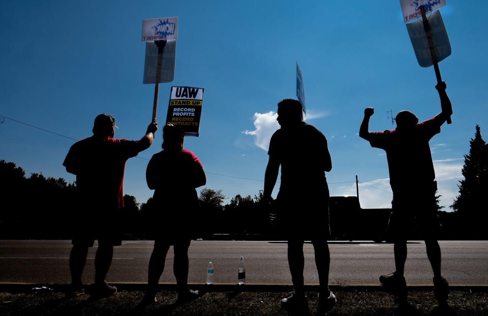 Striking UAW workers from Local 1753 picket outside the Lansing National Distribution Center on Mt. Hope Highway Sunday, Sept. 24, 2023. The GM workers want pay increases and the to end the tiered wage system.