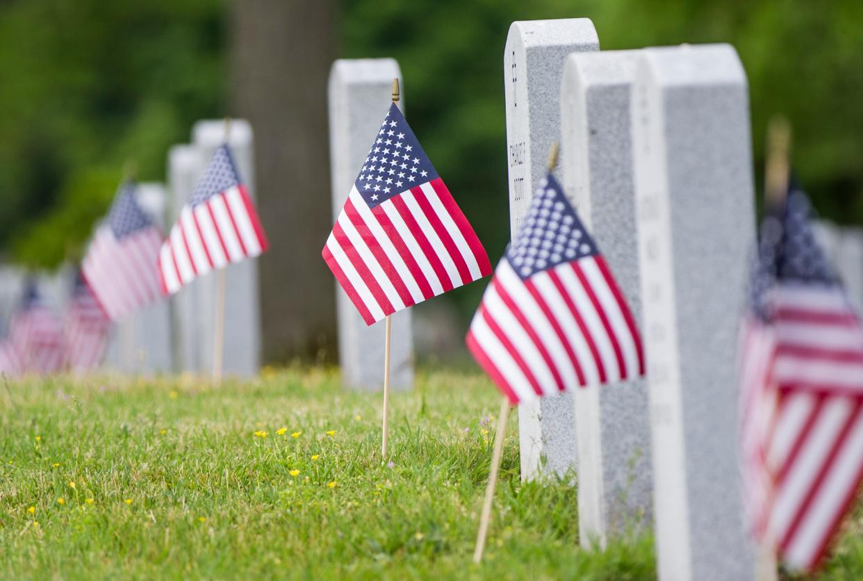 Several events will be held to mark Veterans Day. In this 2016 photo, flags are placed next to gravestones of veterans at Fairview Cemetery in Mishawaka.