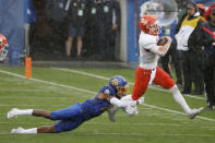 South Dakota State cornerback Don Gardner, left, tries to tackle Sam Houston State quarterback Eric Schmid, right during the first half of the NCAA college FCS Football Championship in Frisco, Texas, Sunday, May 16, 2021. (AP Photo/Michael Ainsworth)