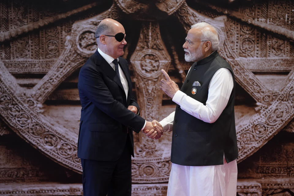 Indian Prime Minister Narendra Modi talks to Germany Chancellor Olaf Scholz upon his arrival at Bharat Mandapam convention center for the G20 Summit, in New Delhi, India, Saturday, Sept. 9, 2023. (AP Photo/Evan Vucci,Pool)