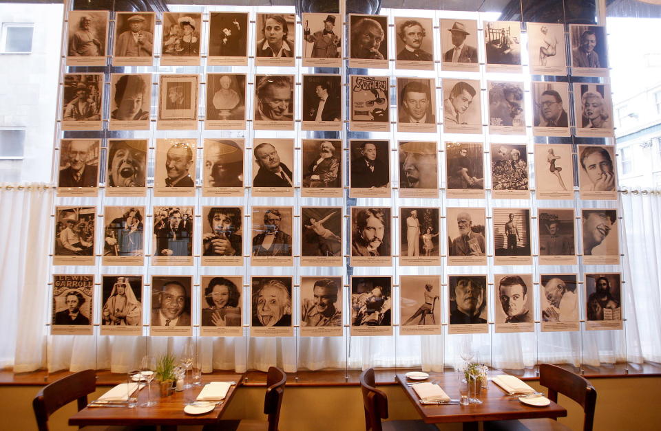 Photographs showing all the people who appeared on the cover of Sgt Pepper Album hang on a wall in the Blakes restaurant at the the newly opened Hard Days Night Hotel in Liverpool, northern England February 1, 2008. The four-star, 110-room Beatles-themed hotel opened its doors to the public and is only a stone's throw away from the site of the famous Cavern Club. REUTERS/Phil Noble