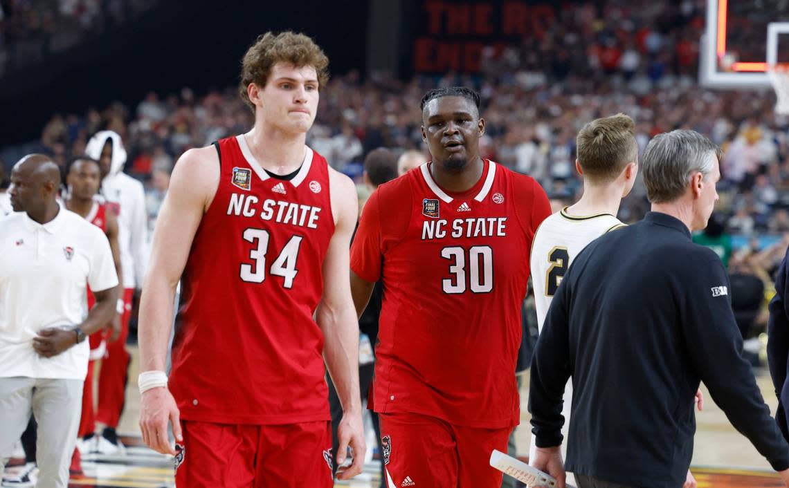 N.C. State’s Ben Middlebrooks (34) and DJ Burns Jr. (30) walk off the court after Purdue’s 63-50 victory over N.C. State in the NCAA Tournament national semifinals at State Farm Stadium in Glendale, Ariz., Saturday, April 6, 2024. Ethan Hyman/ehyman@newsobserver.com