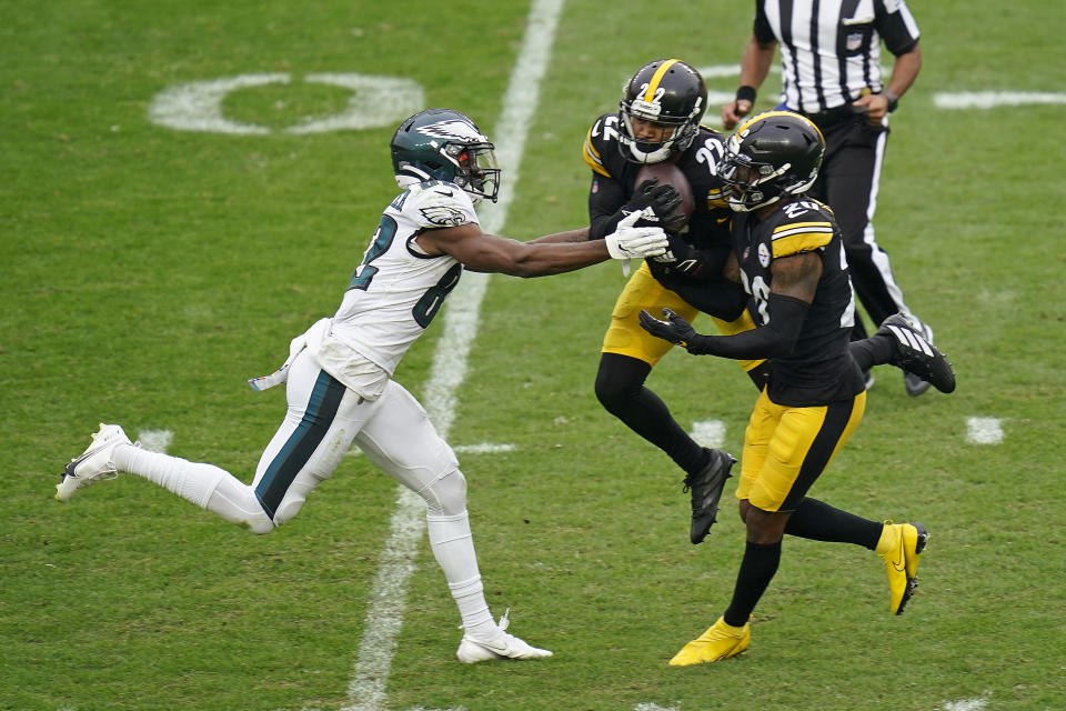 Pittsburgh Steelers cornerback Steven Nelson (22) intercepts a pass intended for Philadelphia Eagles wide receiver John Hightower (82) during the second half of an NFL football game, Sunday, Oct. 11, 2020, in Pittsburgh. The Steelers won 38-29. (AP Photo/Keith Srakocic)