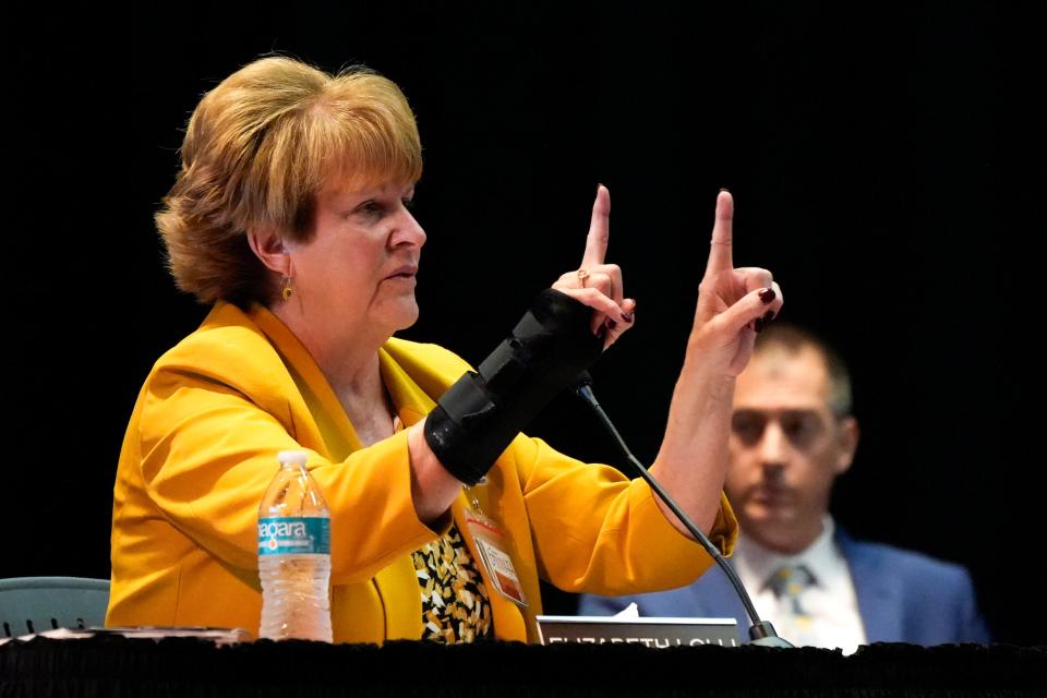 Interim superintendent Elizabeth Lolli, Ph.D., explains a question to board member Darbi Boddy during the Lakota Board of Education meeting on Monday, Oct. 2, 2023, at the Lakota East Freshman Auditorium in Liberty Township.