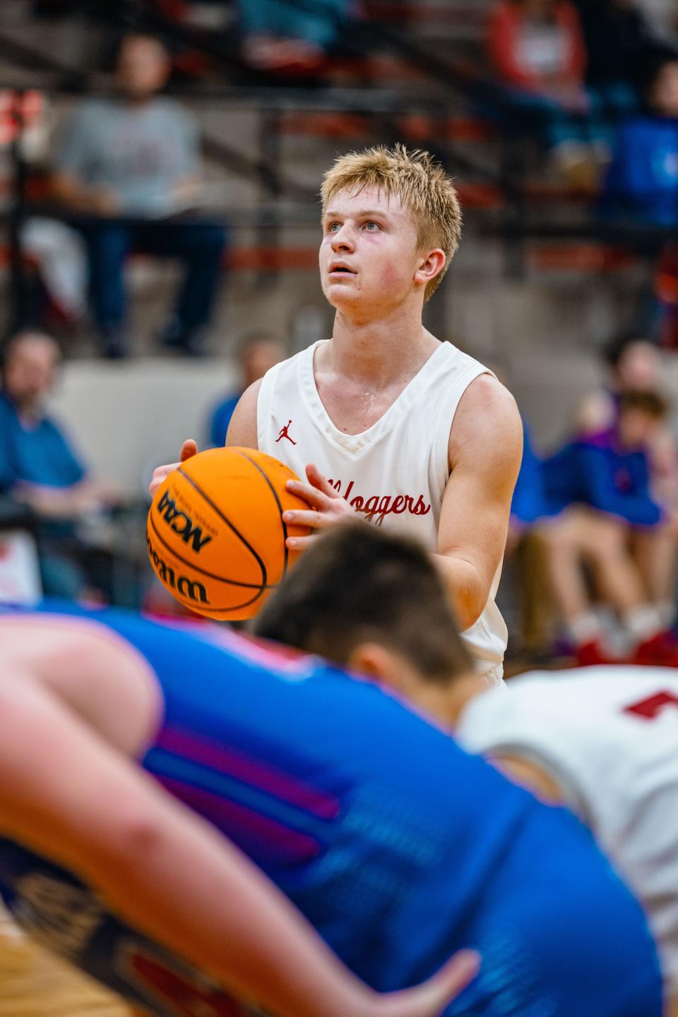 Dewey's Colby Miller stands at the line for free throws during a game vs. Caney Valley.