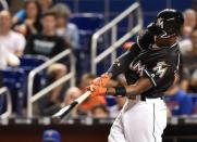 Sep 26, 2016; Miami, FL, USA; Miami Marlins second baseman Dee Gordon connects for a solo home run during the first inning against the New York Mets at Marlins Park. Mandatory Credit: Steve Mitchell-USA TODAY Sports