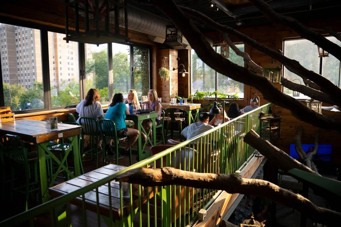 Customers enjoy a meal and drinks at the upper level of the Raleigh Beer Garden in downtown Raleigh, N.C. on Wednesday, June 15, 2022.