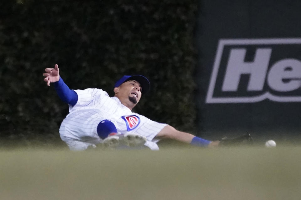 Chicago Cubs' Rafael Ortega is unable to catch a fly ball from Minnesota Twins' Ryan Jeffers during the fifth inning of a baseball game Wednesday, Sept. 22, 2021, in Chicago. (AP Photo/Charles Rex Arbogast)